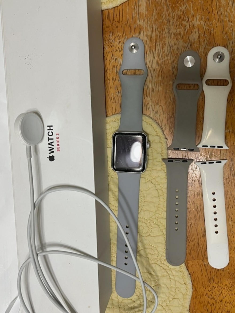 Apple Watch Series 3 with Gray and White Silicone Bands